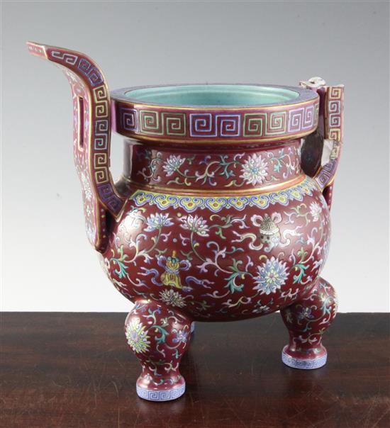 A Chinese famille rose ruby ground tripod censer, Jiaqing six character seal mark and of the period (1796-1820), height 27cm, damage an